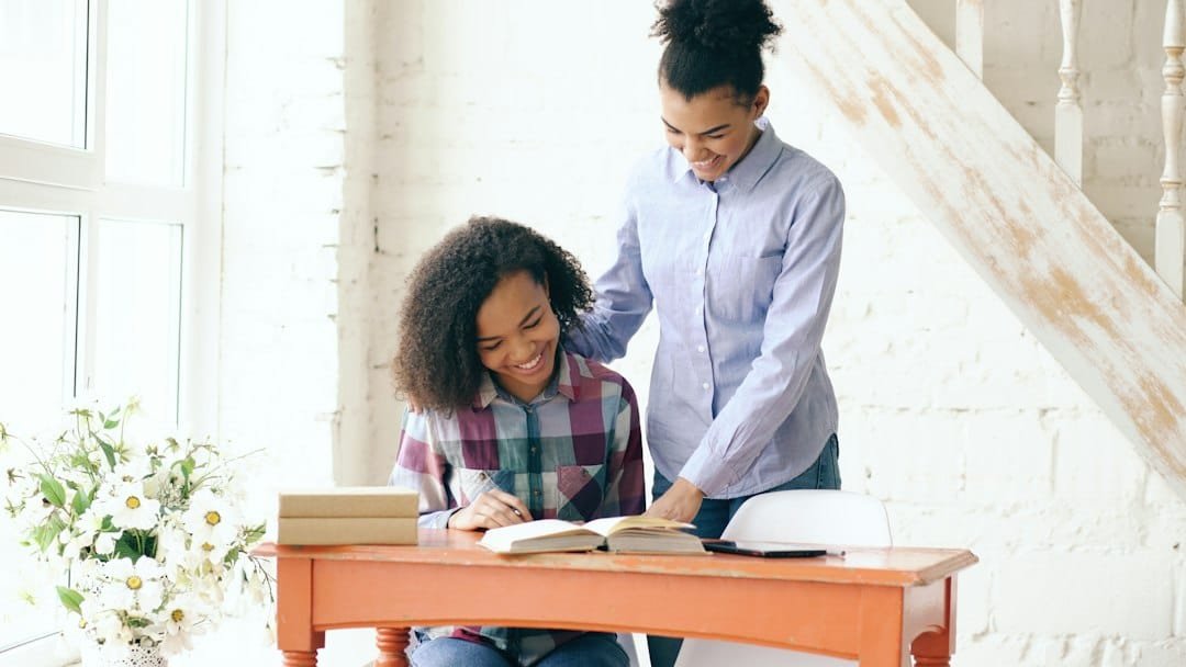 Child studying at home with a tutor